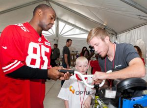 49ers Help Build Bicycles for Youth