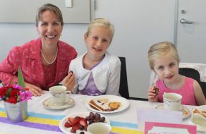 Ladies Sip Tea with Pinky Fingers Down at Etiquette Party