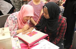 Members of Girl Scout Troop 60053 Organize Arabic Day at the Library