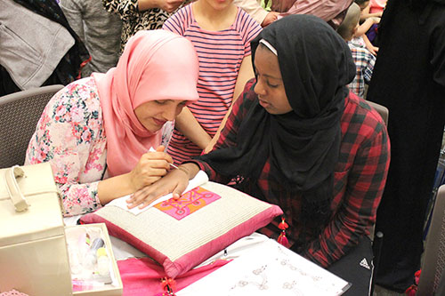 Members of Girl Scout Troop 60053 Organize Arabic Day at the Library