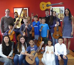 Eight-Year-Old Guitar Student Plays It Forward