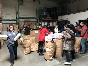 Local Volunteers “Help a Mother Out” by Assembling Diaper Kits