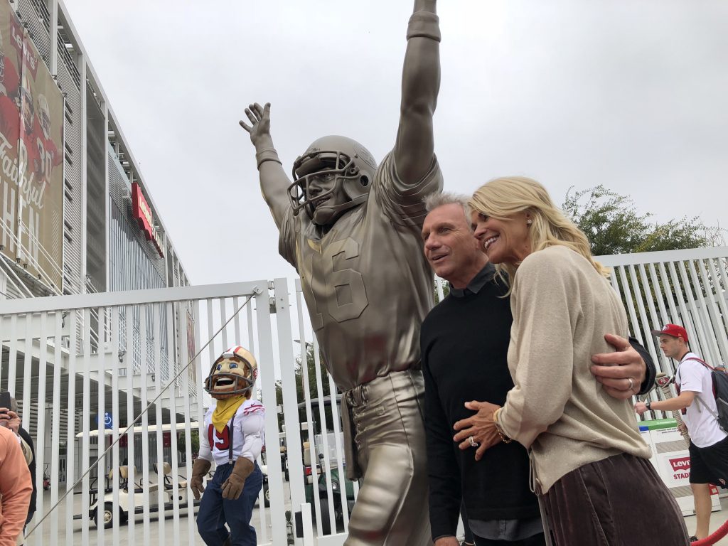 49ers Joe Montana and Wife Pose with The Catch Statue