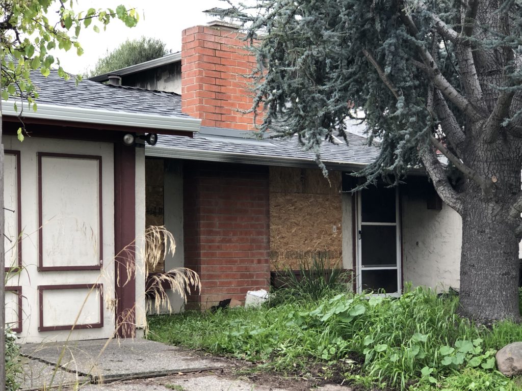 Santa Clara House Fire Charring on Side of House Landscape, Early Morning Fire Sends Three People to the Hospital, Santa Clara Fire Department Battalion Chief Drew Miller