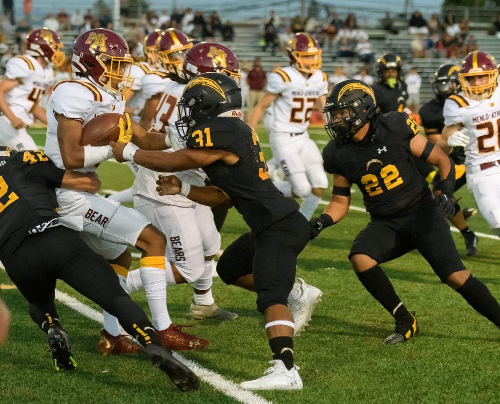 Wilcox narrowly beat Menlo Atherton 21-20 thanks in part to 30 carriers by tailback Walker and strong blocking by Cadena and Hylkema.