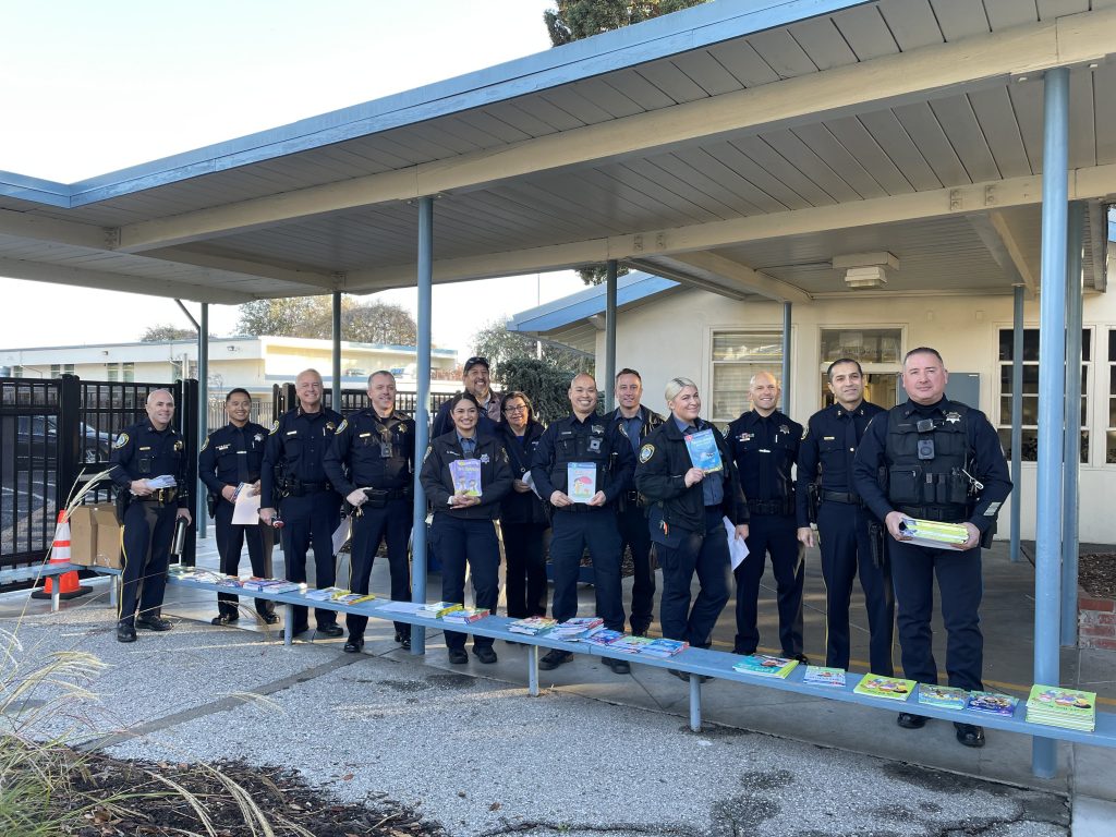 Santa Clara police officers visited Scott Lane Elementary School to read to classrooms and deliver new books in time for the holidays.