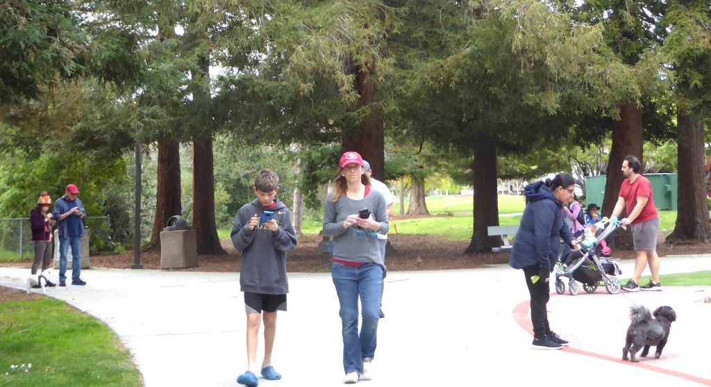 Friends gather at Santa Clara's Central Park every month to get together and battle mythical monsters through the Pokémon Go app.