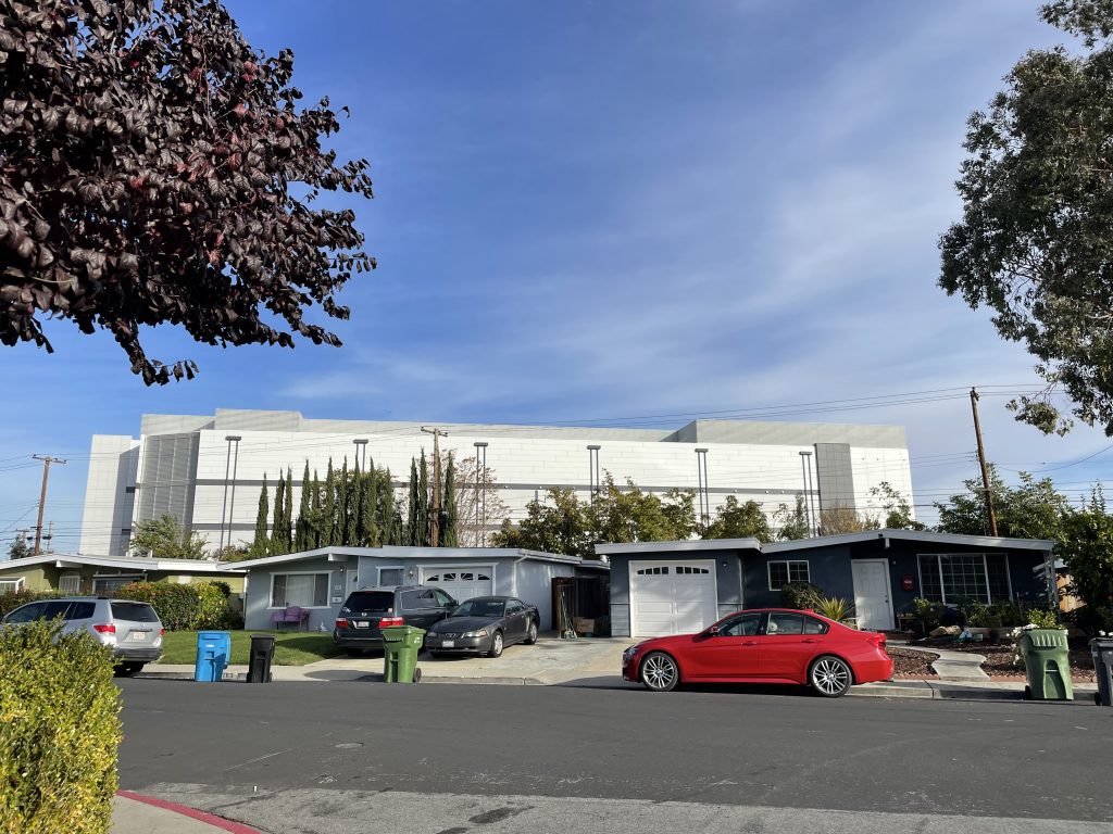 The six-story data center on Memorex Drive creates an imposing sight for single-family homeowners who live on Main Street in Santa Clara.