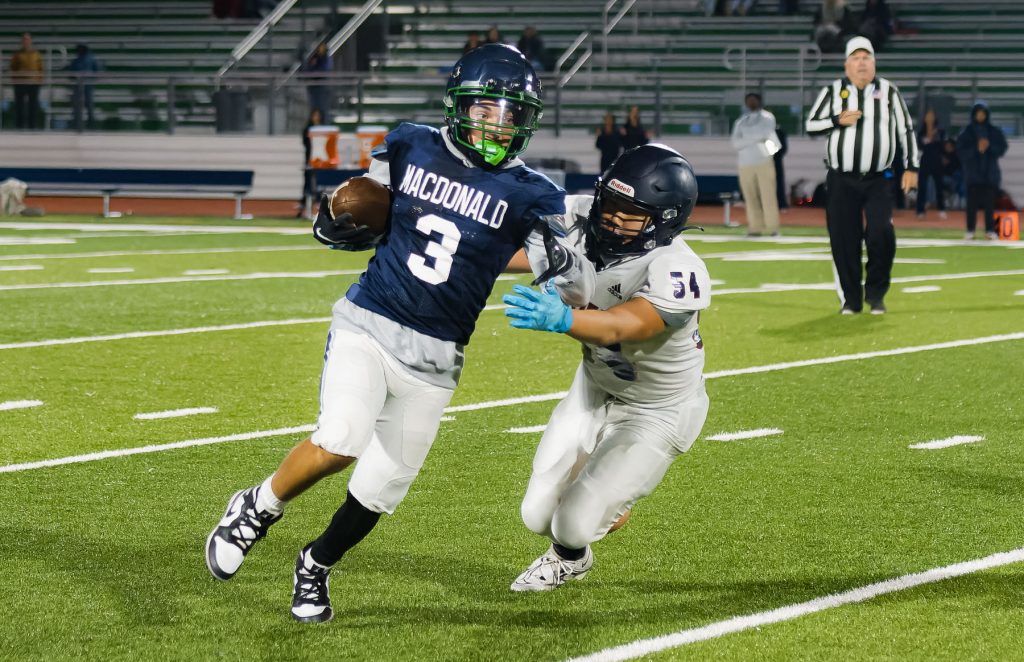 MacDonald High School Condors finishes 500 in first varsity football season with Head Coach Burt Codera and quarterback Moussa Fall.