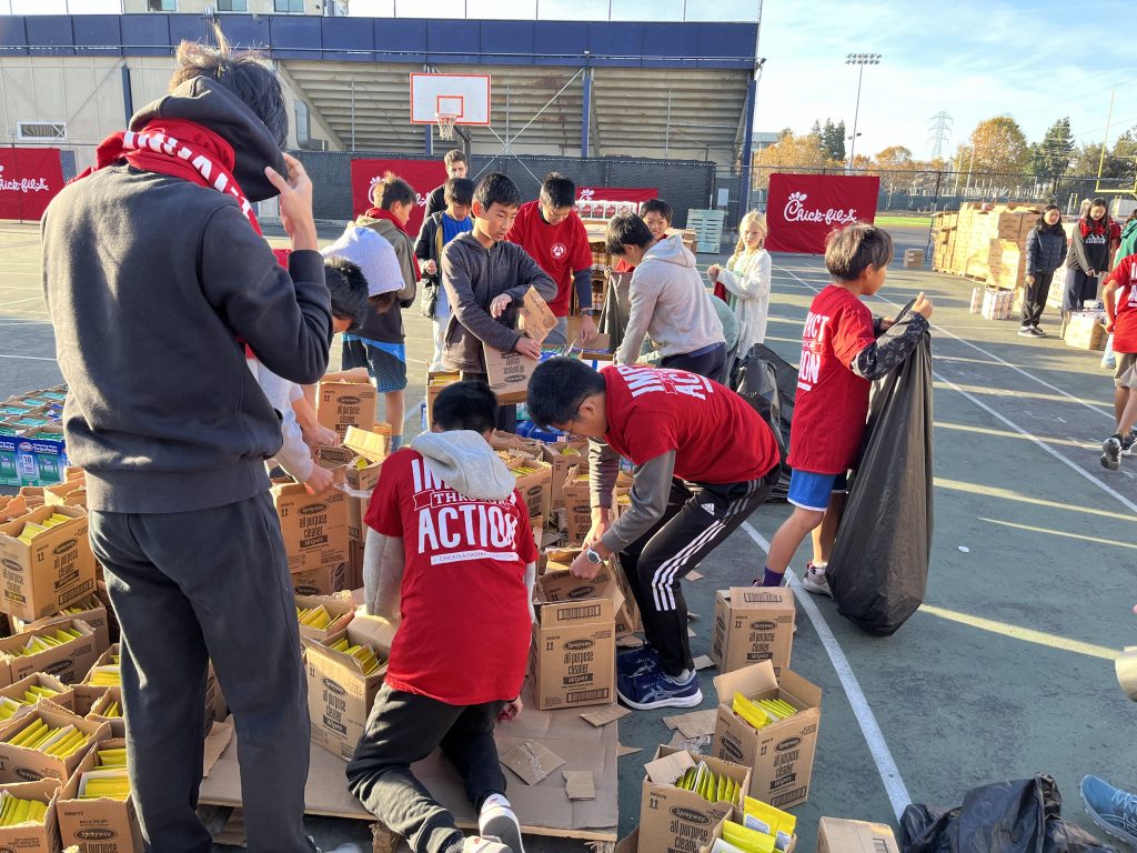 The King’s Academy students with the Chick-fil-A Leader Academy packed care packages to help people over the holidays.