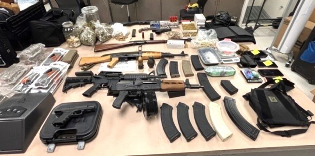 Santa Clara officers arrested six people, confiscated cash, illegal firearms and drugs after a stop for an outstanding warrant led them to a Santa Clara home.