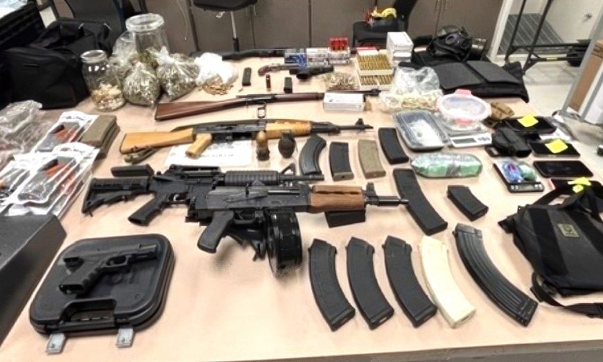 Santa Clara officers arrested six people, confiscated cash, illegal firearms and drugs after a stop for an outstanding warrant led them to a Santa Clara home.