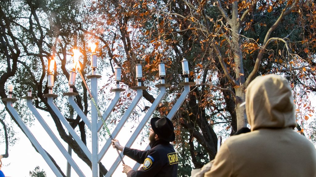 Rabbi Yigal Rosenberg and his family lit the Menorah at Santa Clara's Civic Center Park in the first community lighting event since COVID.