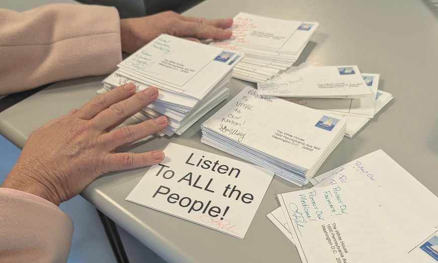 Local residents took part in a national postcard writing campaign designed to express frustration with the Trump administration's actions.